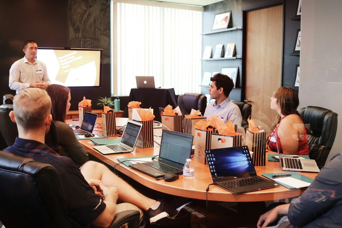 A creative team meeting around a conference table.